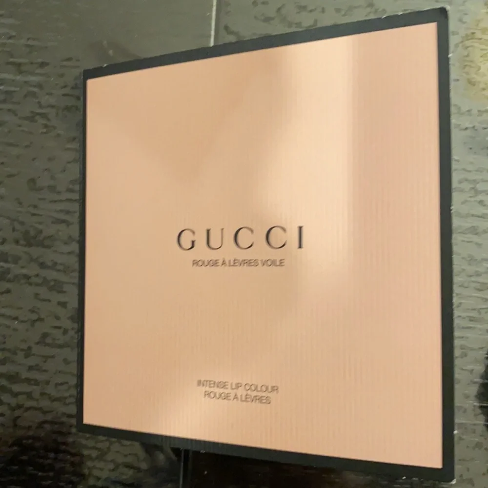 Gucci new sample of intense lip color, red , great for the holidays and travel.